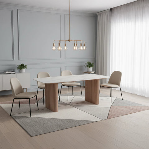 Modern dining room with a white table and beige chairs, featuring a chandelier and decorative plants.