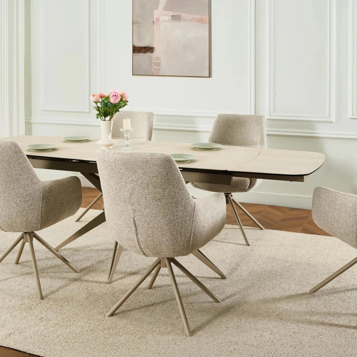 Dining room with a round table and chairs in a modern interior setting.