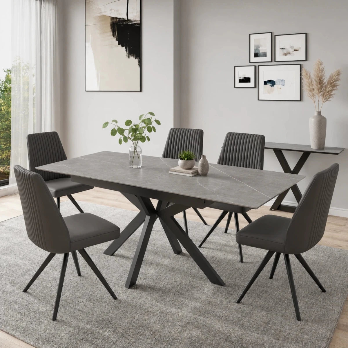 Shop the Amari Ceramic Extending Dining Table with 4, 6 or 8 Athens Grey Faux Leather Chairs. Choose White Gloss or Matt Grey ceramic in two sizes.