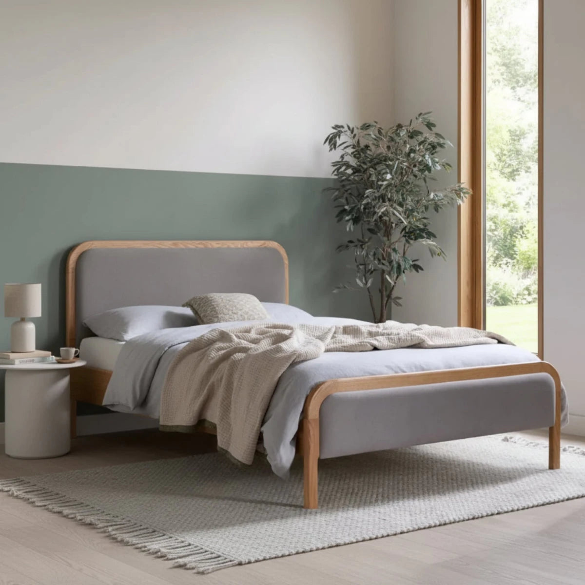 Contemporary bed with soft linen upholstery and natural wood design.