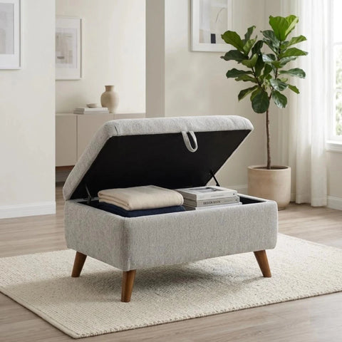 Compact fabric stool with hidden storage and contemporary design.