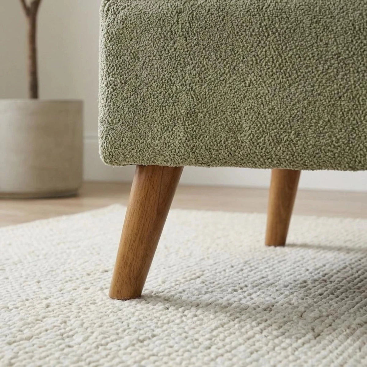 Wooden sofa legs detail showing sturdy build and elegant finish.