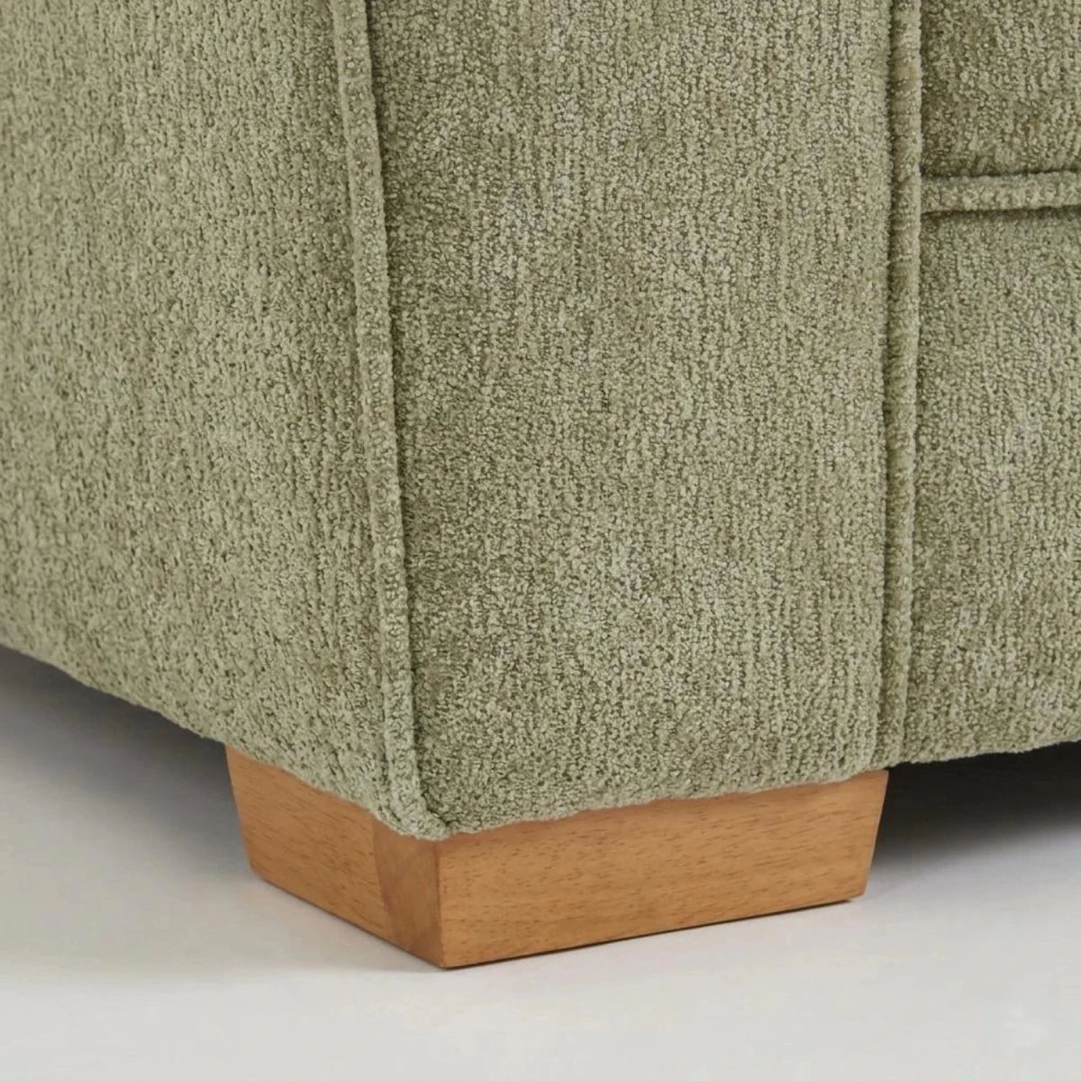 Wooden sofa legs detail showing sturdy build and elegant finish.