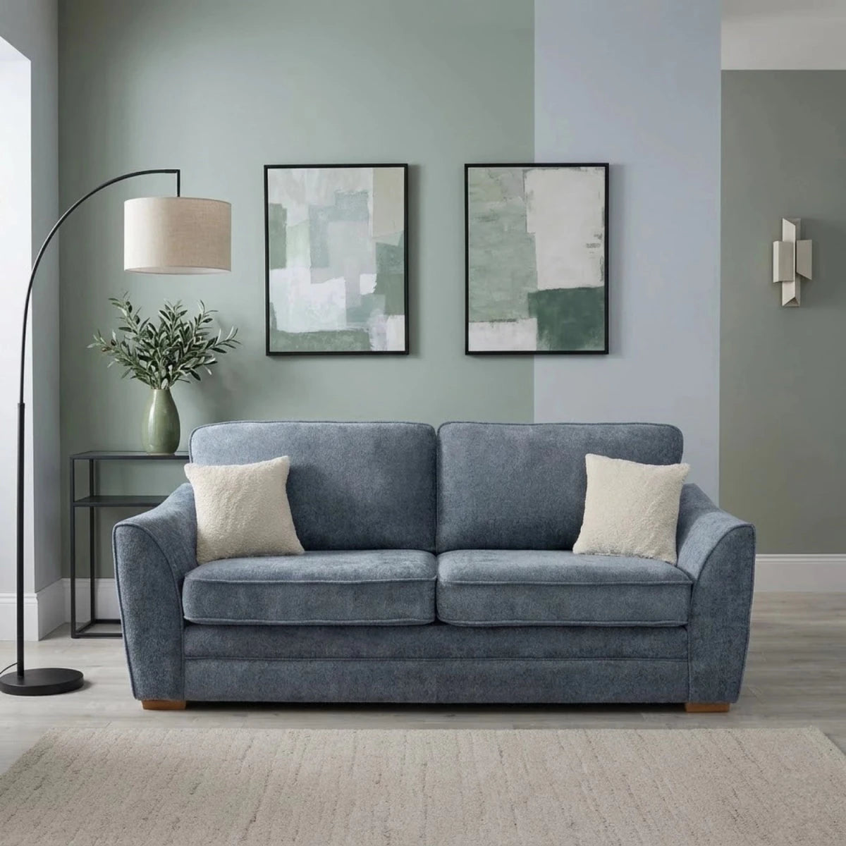 3 seater fabric sofa with curved arms and supportive seating.