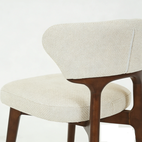 Chair with beige cushioned seat and backrest on a white background