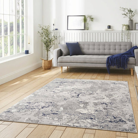 Apollo 2677 Modern Abstract Rug in Grey/Navy styled in a modern bedroom