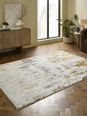 Apollo CK406 Modern Abstract Rug in Grey/Gold styled in a modern room