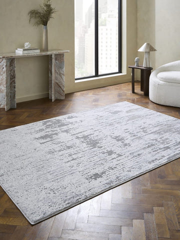 Apollo CK406 Modern Abstract Rug in Grey/Silver styled in a modern room