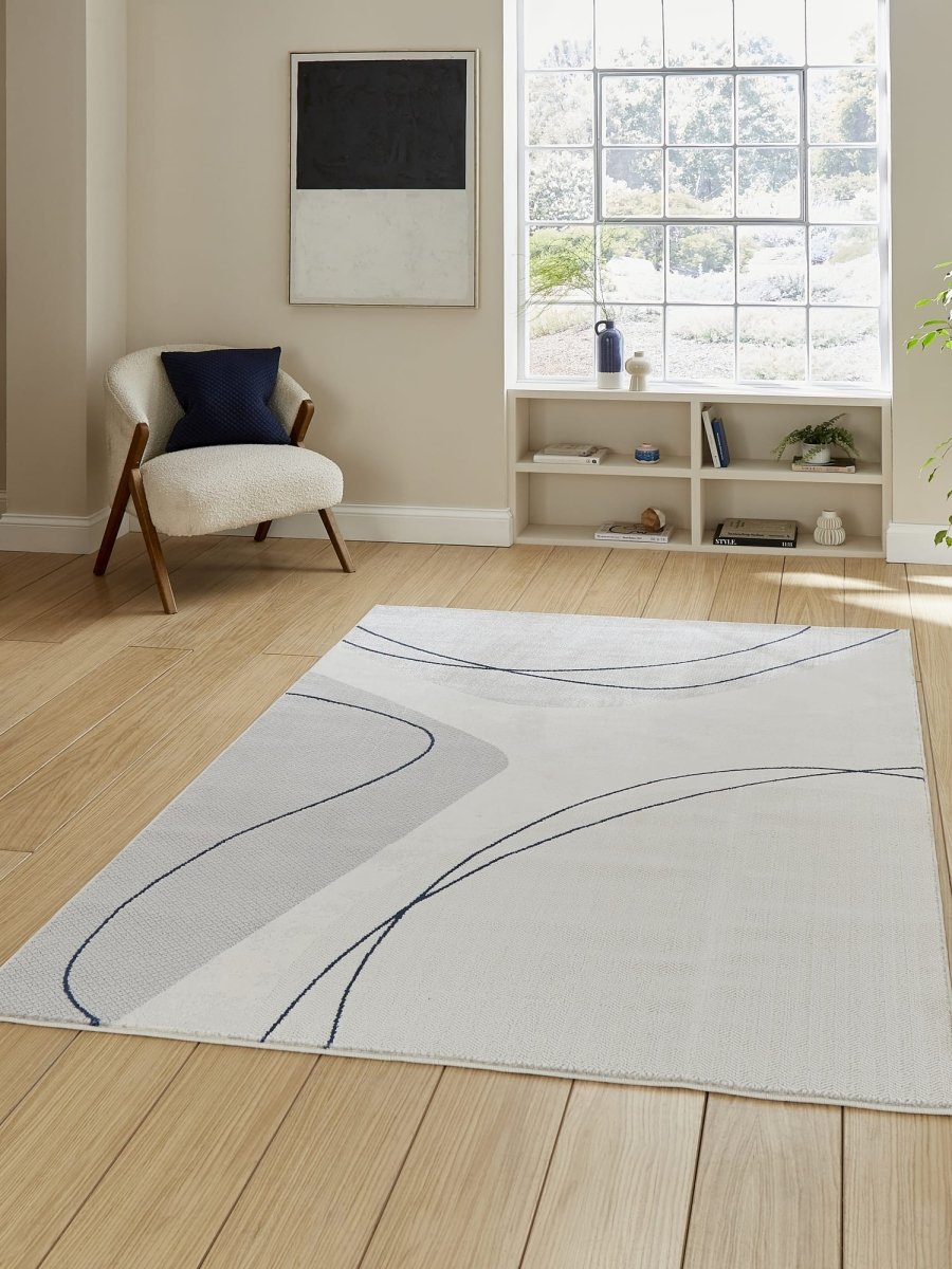 Apollo E9974 Modern Abstract Rug in Grey/Blue styled in a modern room