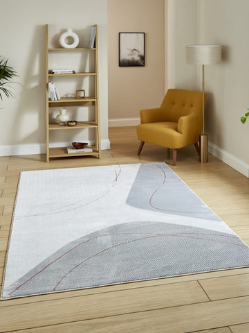 Apollo E9974 Modern Abstract Rug in Grey/Rose styled in a modern room