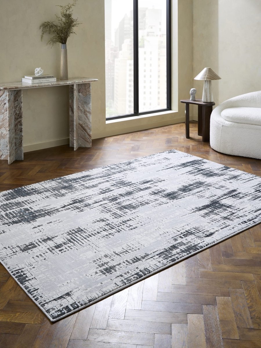 Apollo HE052 Modern Abstract Rug in Grey/Dark Blue styled in a modern room