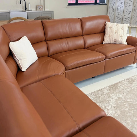 Premium tan leather upholstery with soft finish.