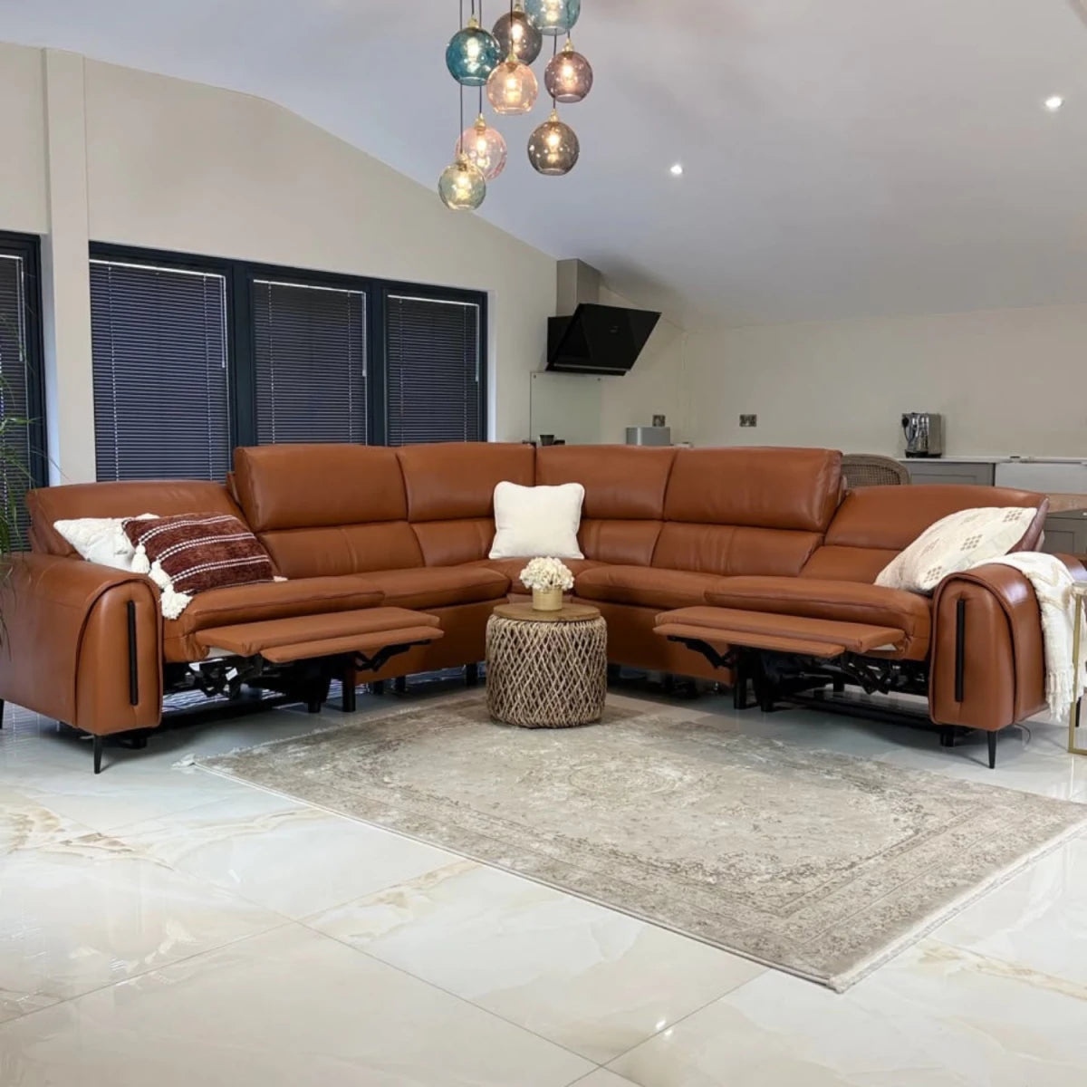 Upholstered in soft tan leather for a warm, premium look.