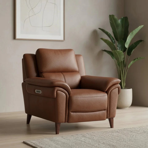 Luxury leather recliner chair with adjustable headrest and soft cushioning.