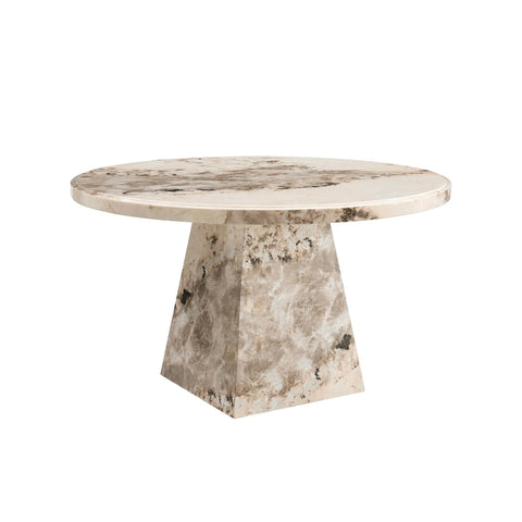 Round marble table with a pedestal base on a white background