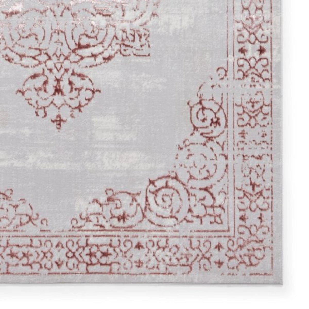 Close-up of a decorative rug with intricate patterns on a white background