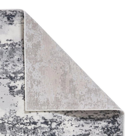 Artemis grey abstract rug styled in a contemporary living room - Back details