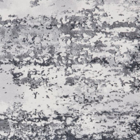 Close up fo Artemis grey abstract rug styled in a contemporary living room