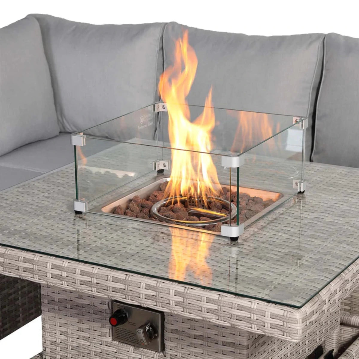 Rising firepit table with adjustable height and built-in flame feature.