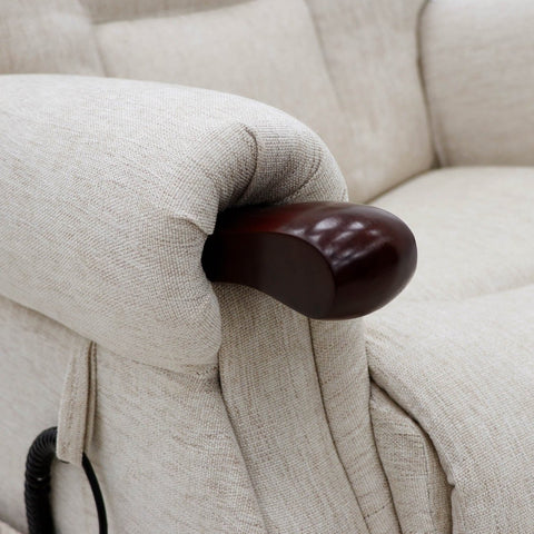 Close-up of a beige upholstered Rise recliner chair showing the armrest with a glossy dark brown wooden accent and part of a black control cord.