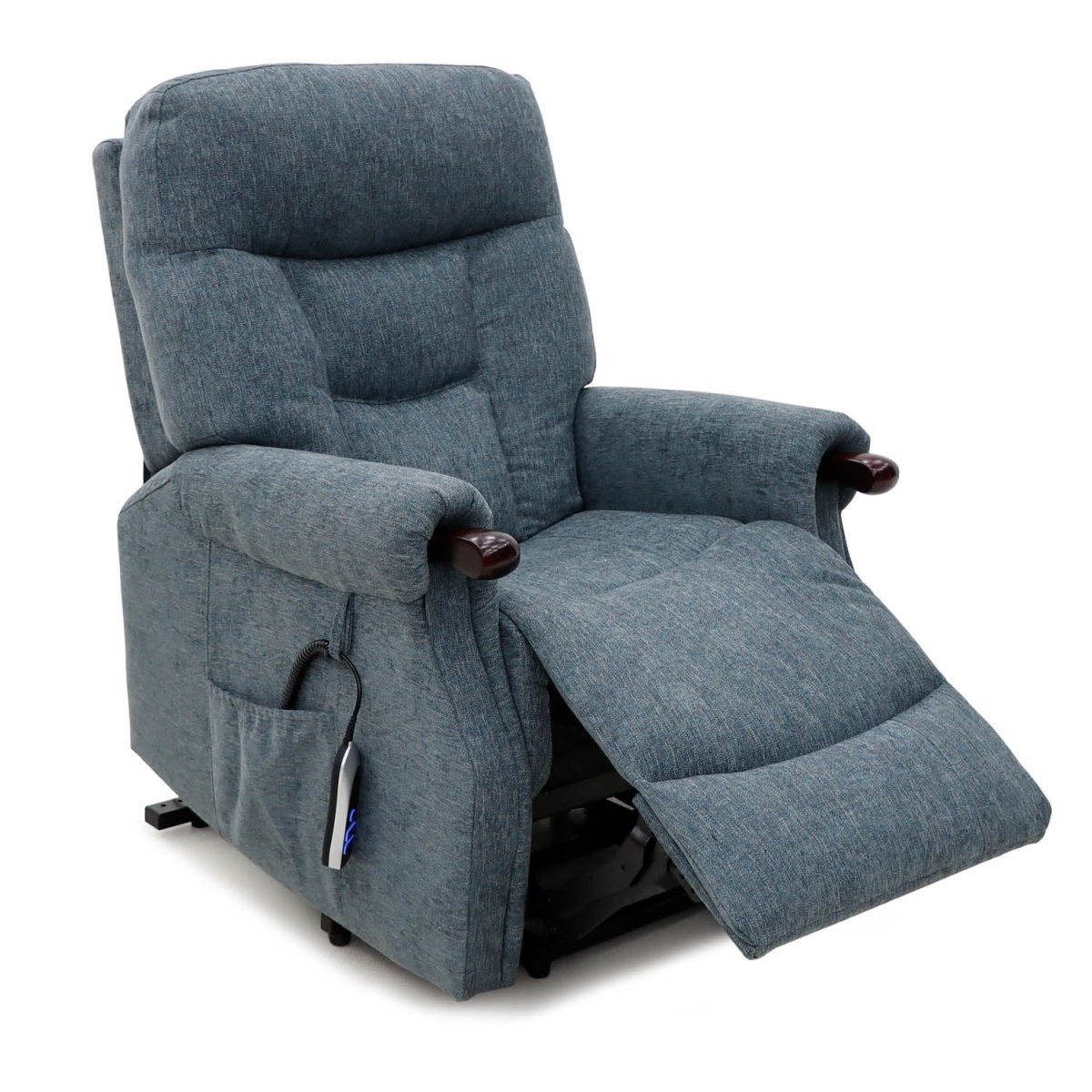 A blue-gray upholstered recliner chair with the footrest extended, shown on a clean white background. The chair features dark wood-look armrest controls and a side pocket with a remote attached.