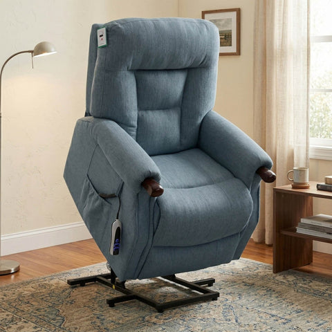 Blue recliner chair in a living room setting with a lamp and window in the background.