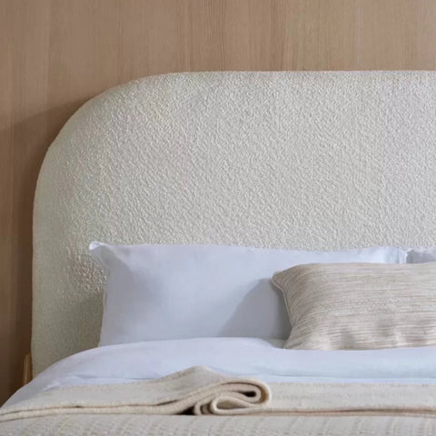Softly curved padded headboard with upholstered fabric finish.