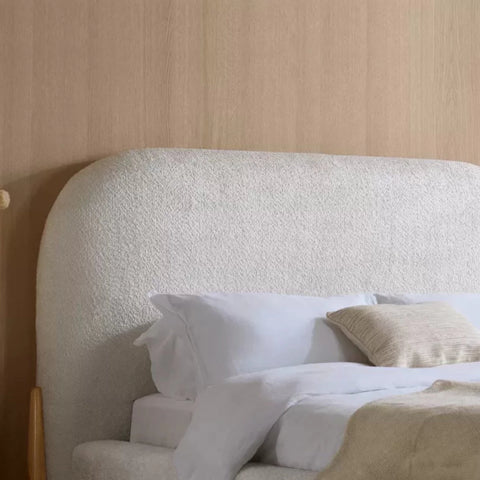 Rounded headboard designed for comfort and modern elegance.