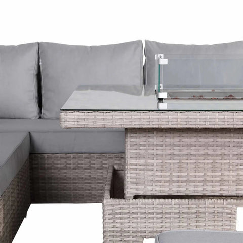 Rising firepit table with adjustable height and built-in flame.
