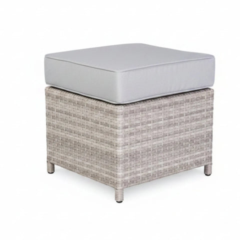 Comfortable garden ottoman for seating or footrest use.