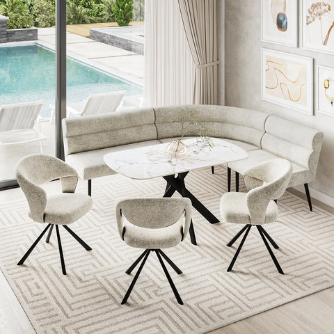 A modern 5-piece dining set featuring a curved upholstered banquette sofa, a round white marble-top table with a black cross base, and four matching swivel chairs with textured cream upholstery and black metal legs, arranged on a geometric patterned rug in a bright dining room with a pool view.