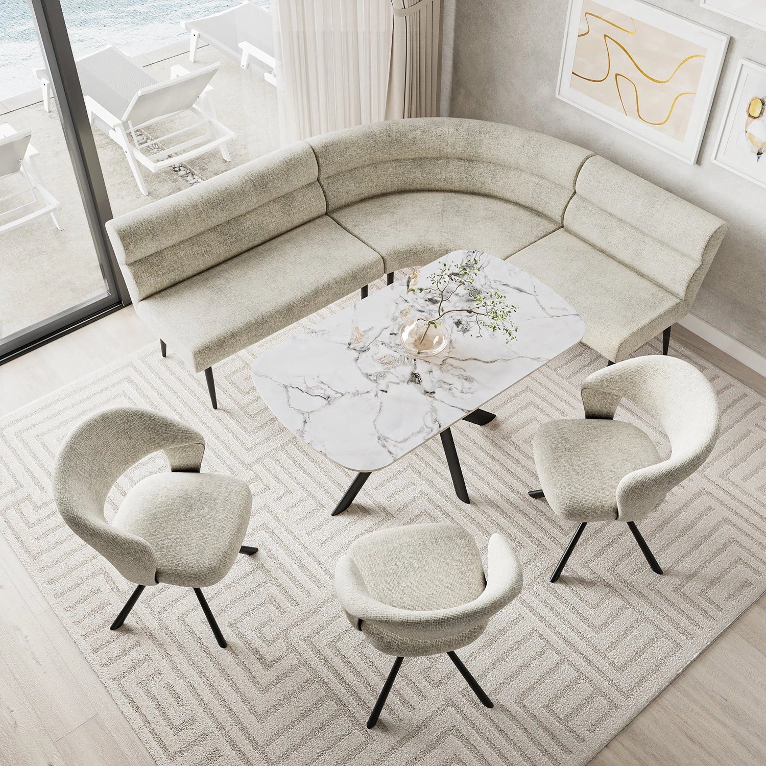 A modern curved sectional sofa dining bench in a light beige bouclé fabric, styled in a bright living room with four matching armchairs, a marble-top coffee table, and a geometric pattern rug.