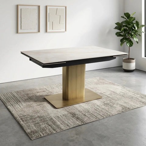Braxton extending dining table with white sintered stone top, bronze gold pedestal base and double extension from 140cm to 200cm.