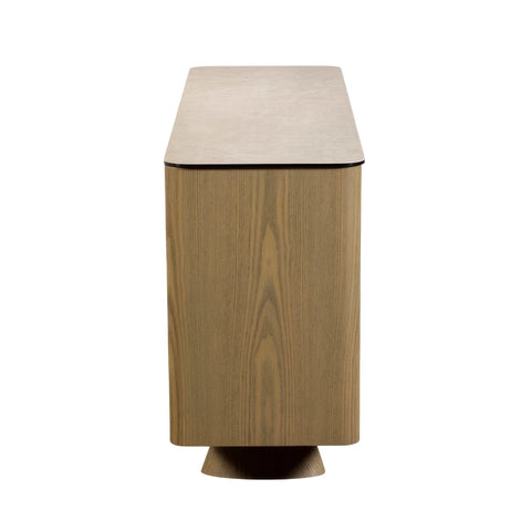 Side view of  Arlo Cream Ceramic 3 Door Sideboard with push-to-open doors, sculptural ash wood legs and a stone-inspired ceramic top. 