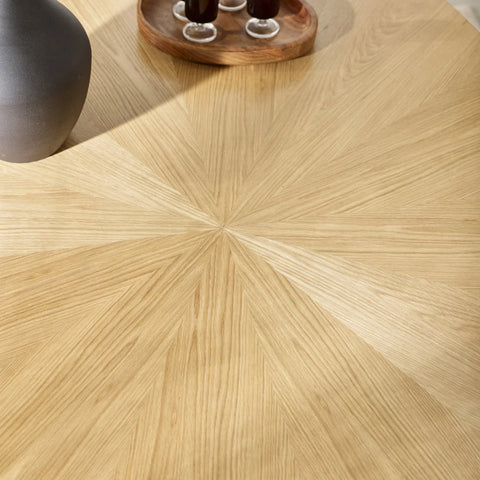 Close-up of a light natural wood tabletop with a radial starburst grain pattern of Bondi 200cm Oval Dining Table 