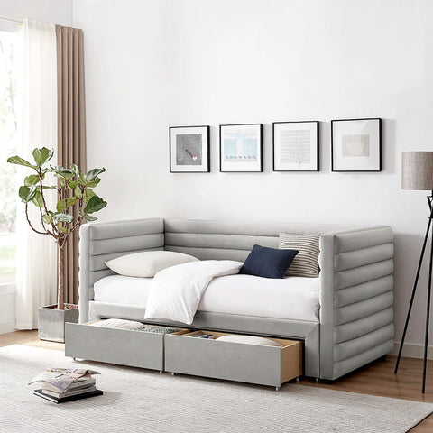 Bellanova Luxe Daybed. A light grey velvet upholstered daybed with padded channel tufting and under-bed storage drawers.