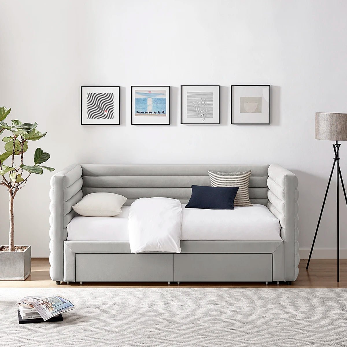 Bellanova Luxe Daybed. Lifestyle image of a light grey velvet upholstered daybed with tufted armrests. 