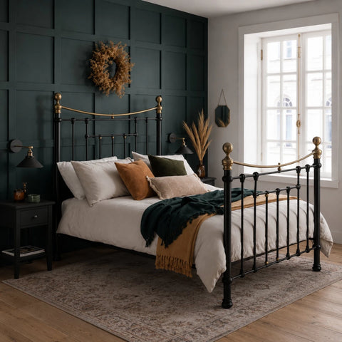 Victorian style metal bed with antique brass detailing.