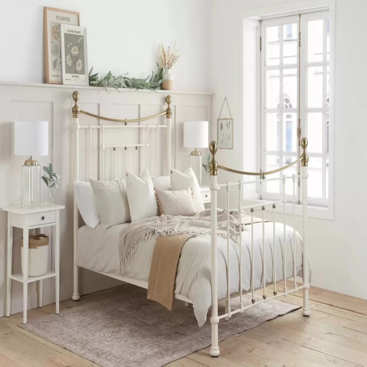 Traditional metal bed with decorative brass accents and sturdy structure.