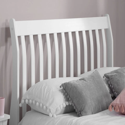 Wooden bed with clean lines and durable pine construction.