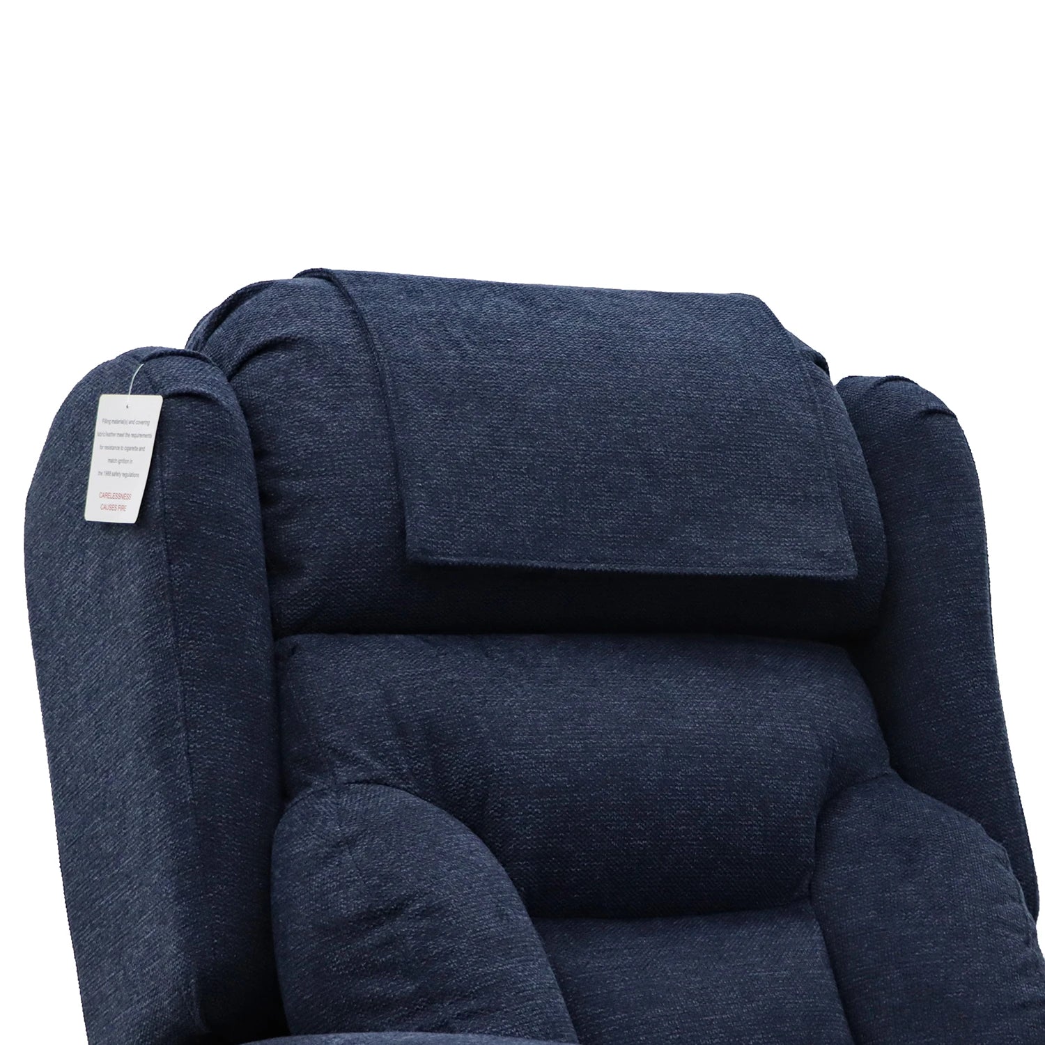 Close-up of a Berkshire high-back upholstered chair in dark navy blue fabric, showing the padded headrest, side armrests, and a small hanging product tag on the left side against a plain white background.