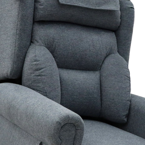 Close-up of a gray upholstered recliner chair showing padded backrest, armrest, and headrest cushion against a white background.
