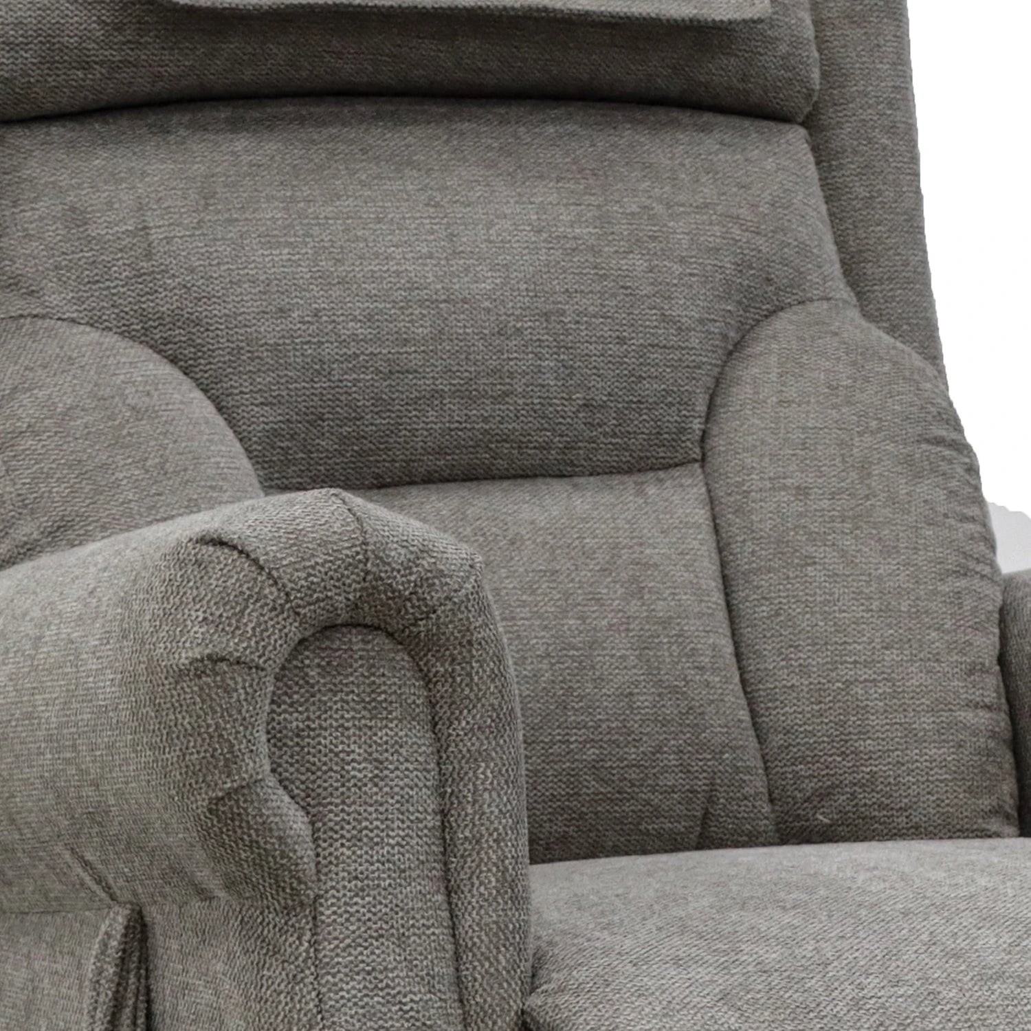 Close-up of a Mink upholstered rise recliner chair showing the textured fabric, padded backrest, and rolled armrest.