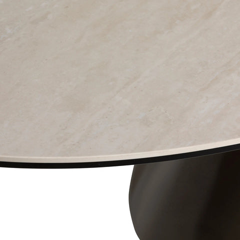 Close-up of a beige ceramic tile top of Brann Dining Table