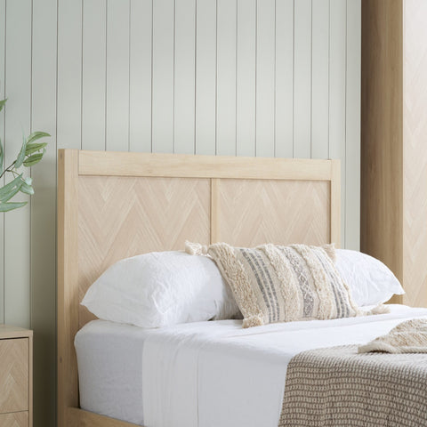 Wood effect headboard with architectural chevron pattern.