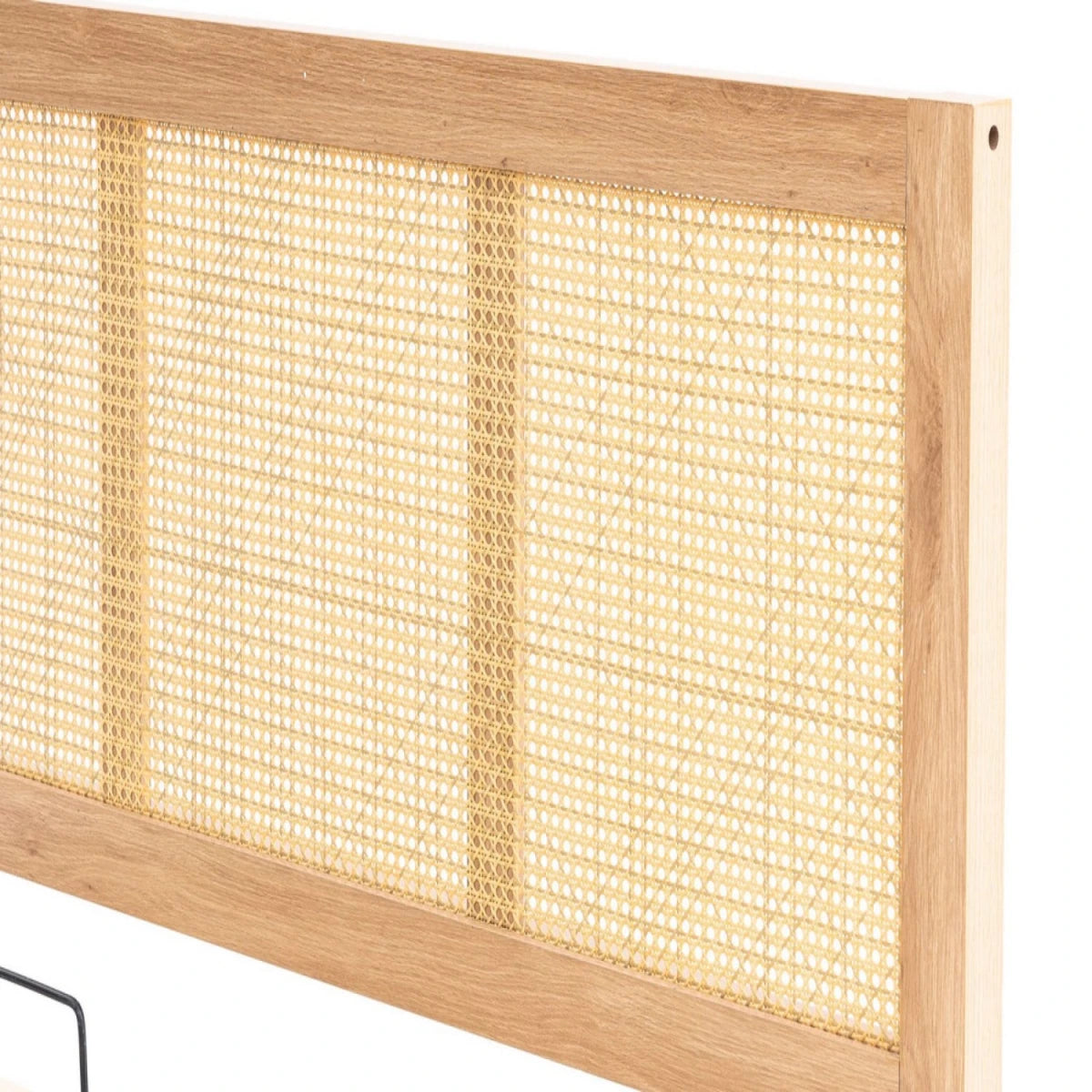 Rattan panel headboard with relaxed aesthetic.