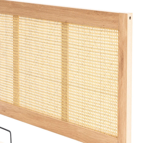 Rattan panel headboard with relaxed aesthetic.