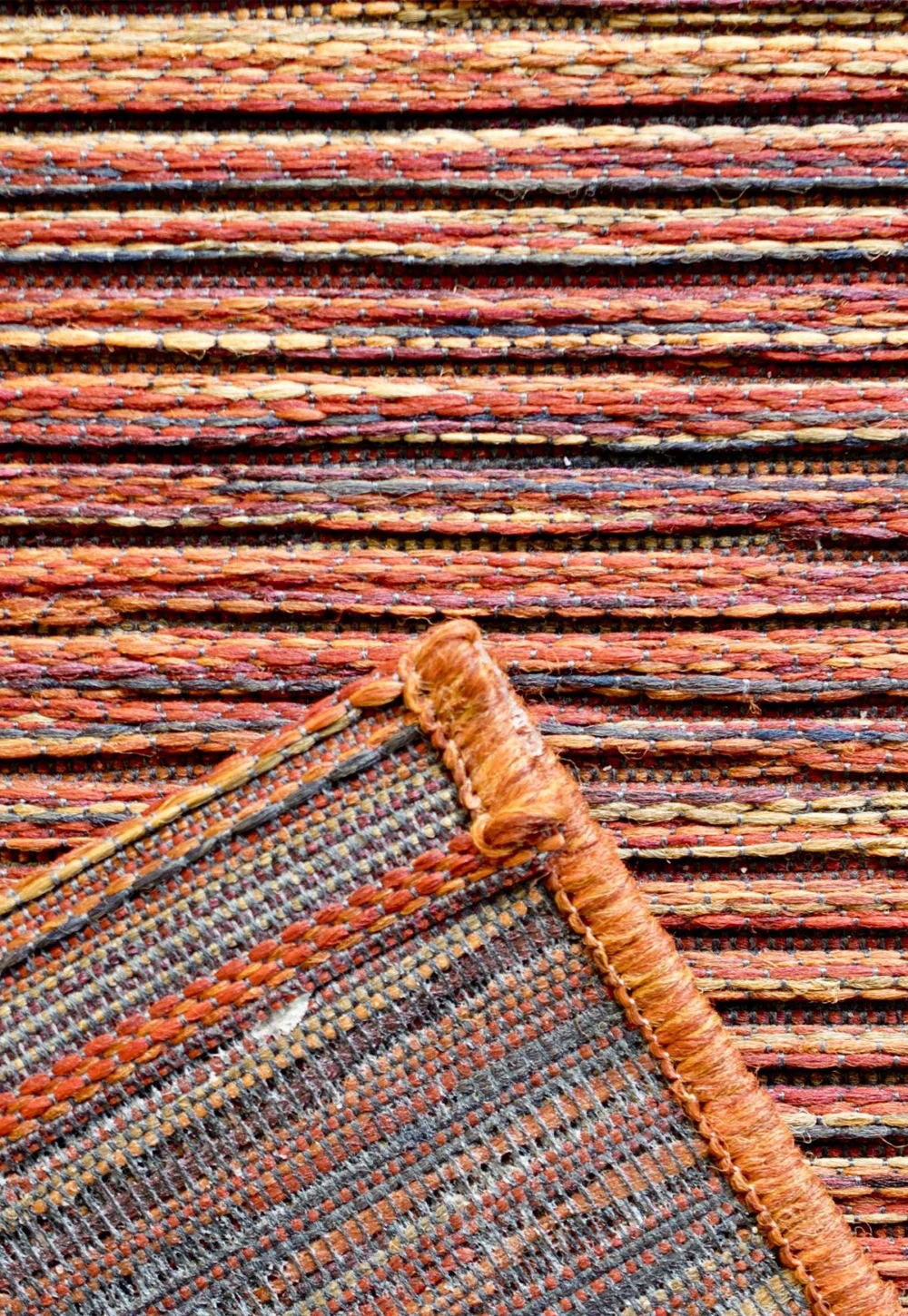 Brighton Orange Striped Indoor Outdoor Rug. Available in various sizes and colours - Reverse of Rug Image