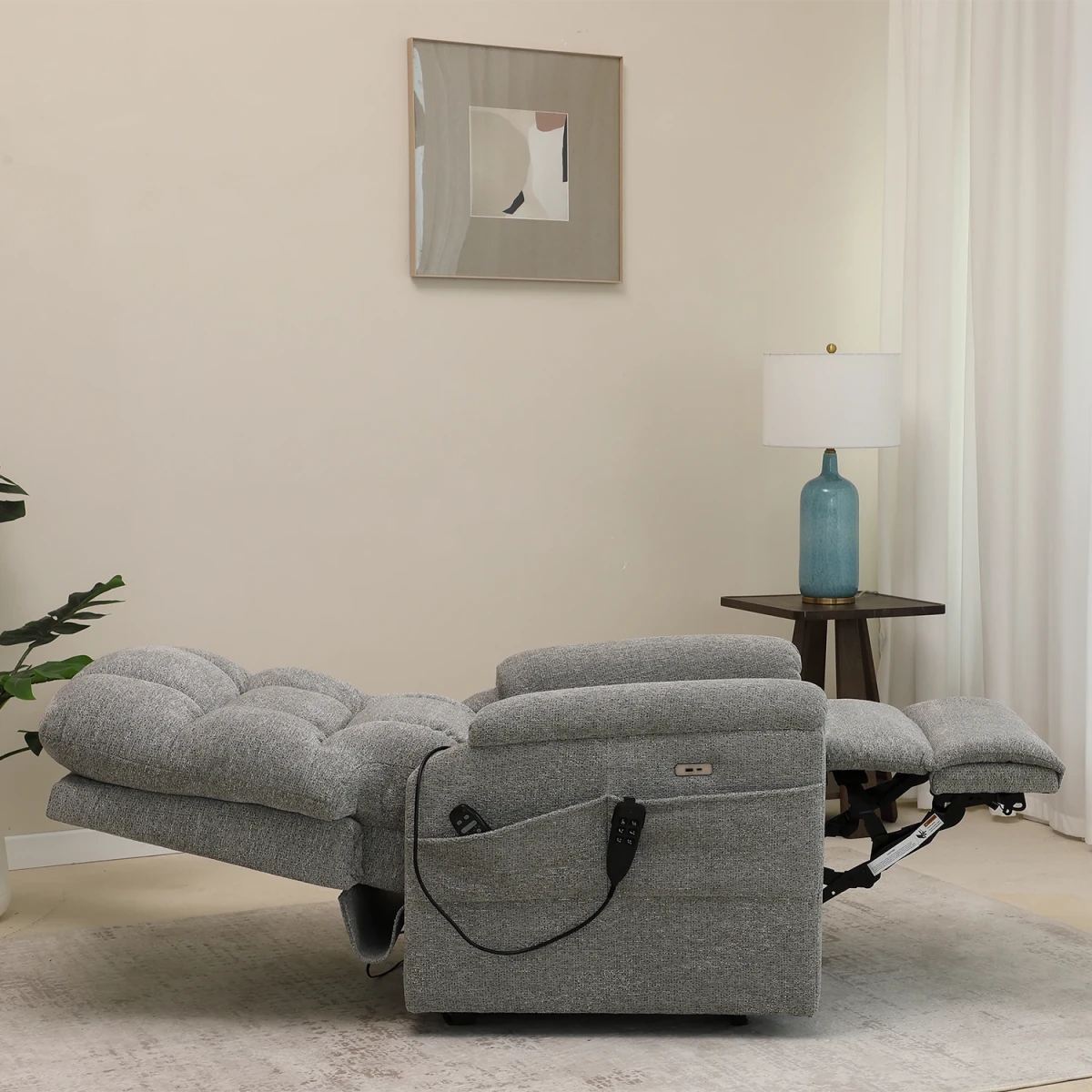 Reclined View of Brynn Grey triple motor riser recliner with heat, massage and independent headrest adjustment. 