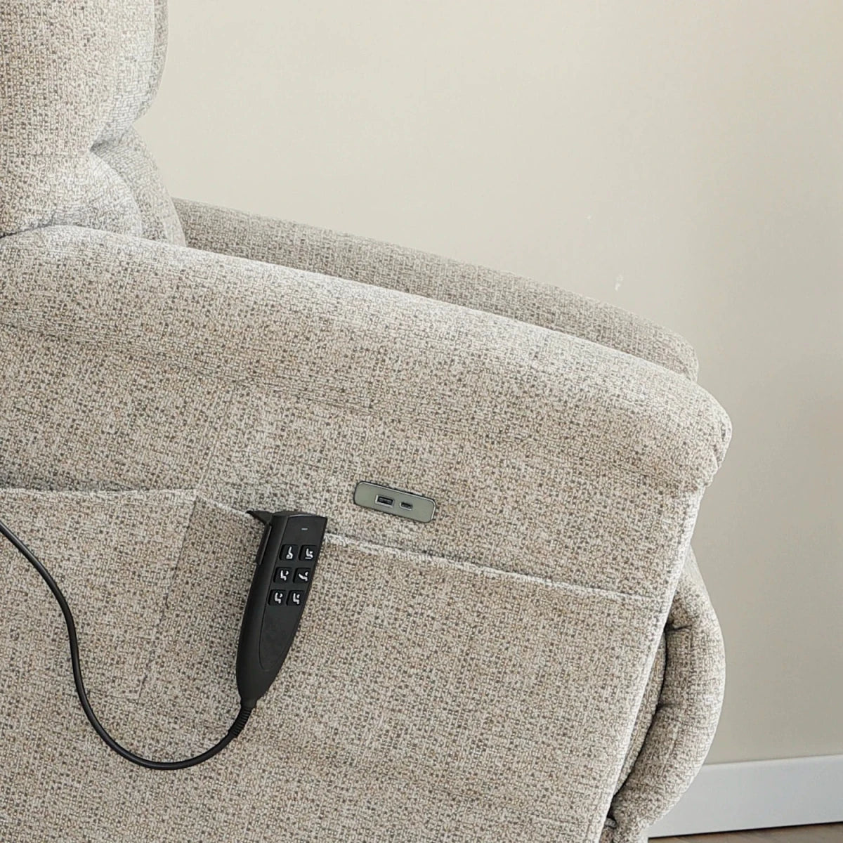 Close up of Arm of Brynn Egyptian Sand Fabric  triple motor riser recliner with heat, massage and independent headrest adjustment. 
